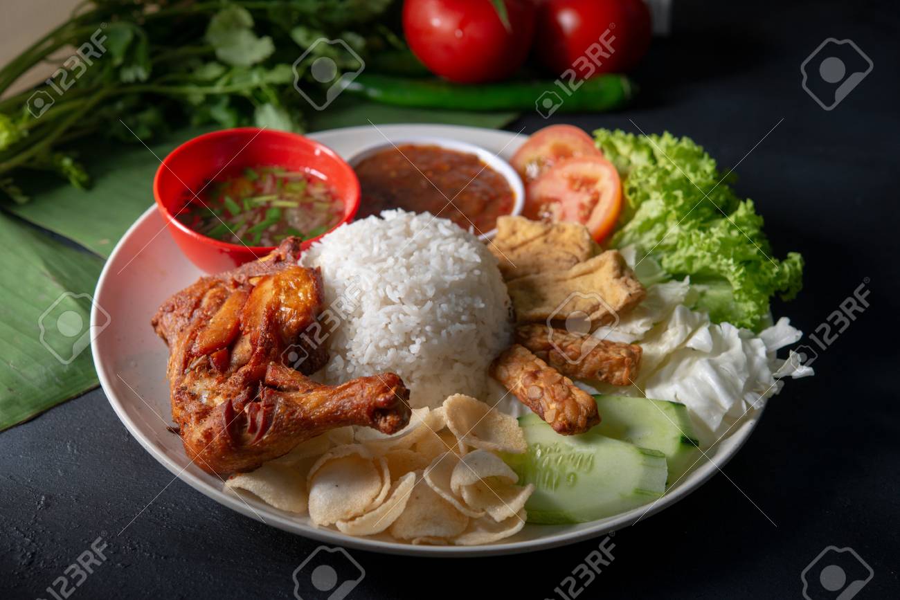 Nasi lemak kukus with fried drumstick, popular traditional Malaysian local food. - 118841418 Nasi lemak kukus with fried drumstick, popular traditional Malaysian local food. - 118841418