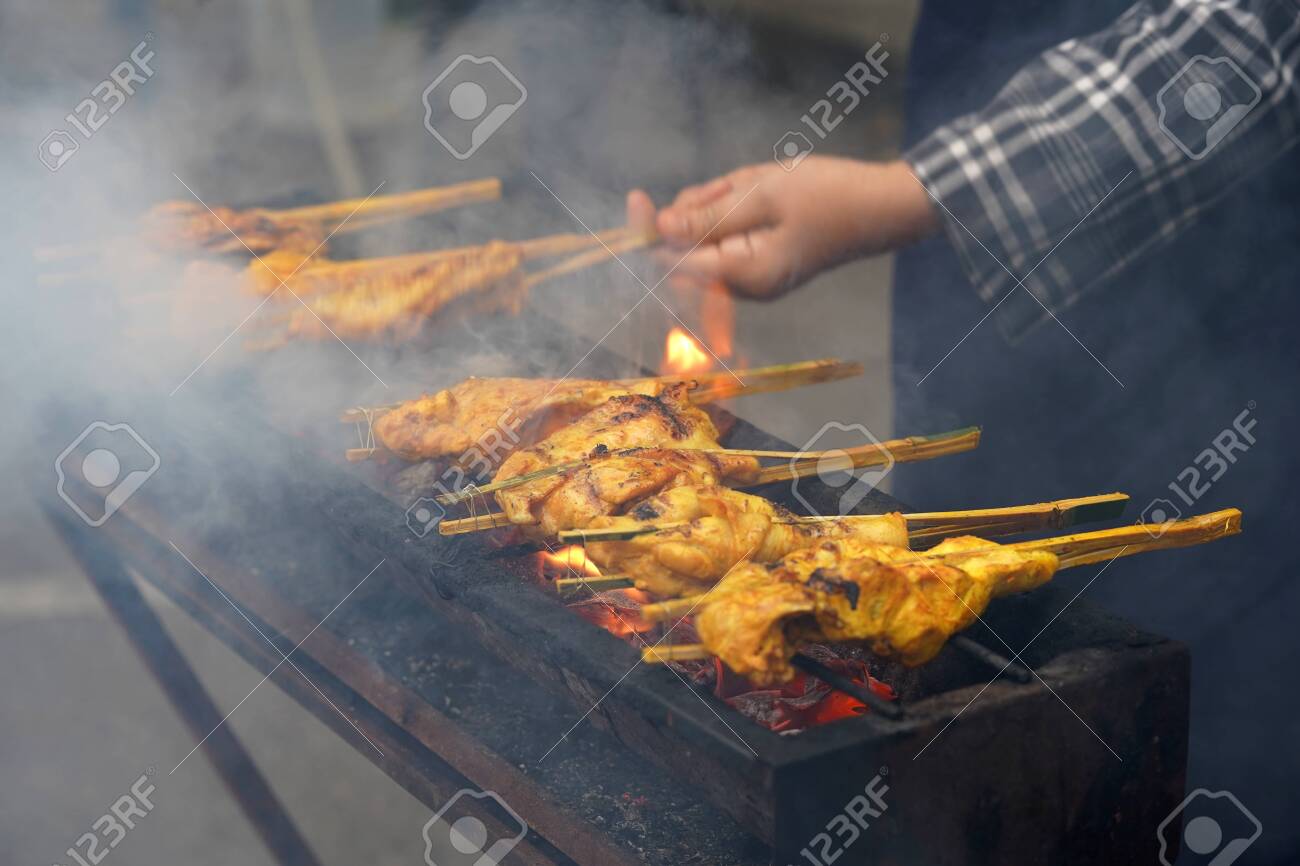 Malaysian traditional dishes, popular grilled spiced chicken Ayam Percik selling in Bazaar during the holy month of Ramadan. - 128375239 Malaysian traditional dishes, popular grilled spiced chicken Ayam Percik selling in Bazaar during the holy month of Ramadan. - 128375239