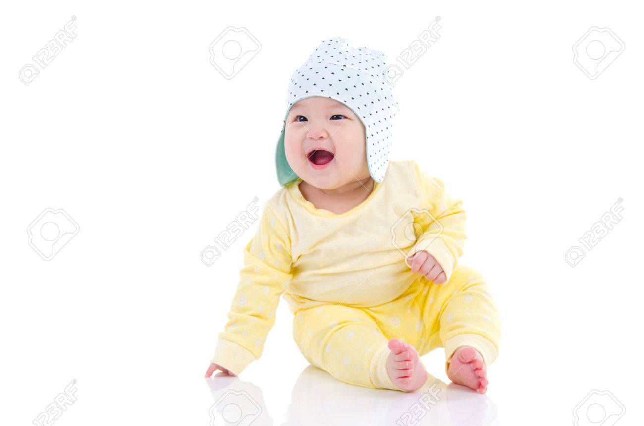 Asian baby sitting on the floor and laugh - 60660087 Asian baby sitting on the floor and laugh - 60660087