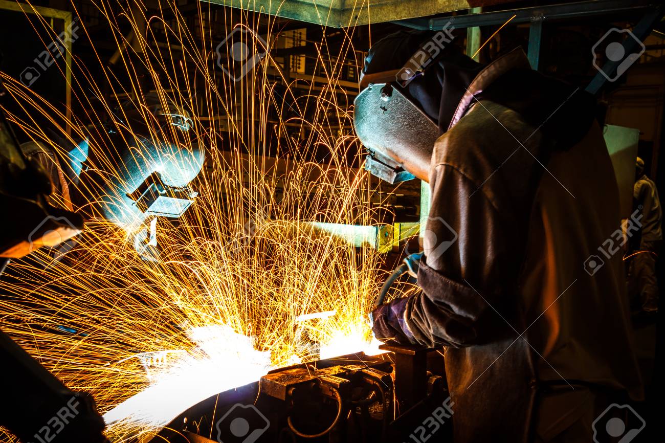 worker good welding technician in the automotive industry stock welding technician