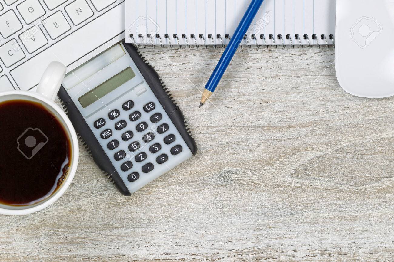 Top view of office desktop image with computer, notepad, calculator pencil and coffee cup. - 34938052 Top view of office desktop image with computer, notepad, calculator pencil and coffee cup. - 34938052