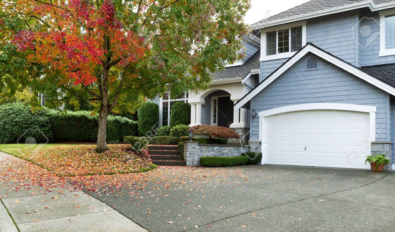 Front view of modern residential home during early autumn season in Northwest of United States. Maple trees beginning to change leaf colors. - 47034072 Front view of modern residential home during early autumn season in Northwest of United States. Maple trees beginning to change leaf colors. - 47034072