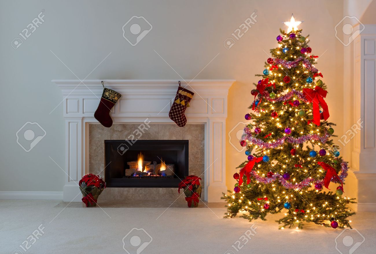 Christmas Tree In Living Room bright christmas tree and glowing fireplace in living room. stock Christmas Tree In Living Room bright christmas tree and glowing fireplace in living room. stock