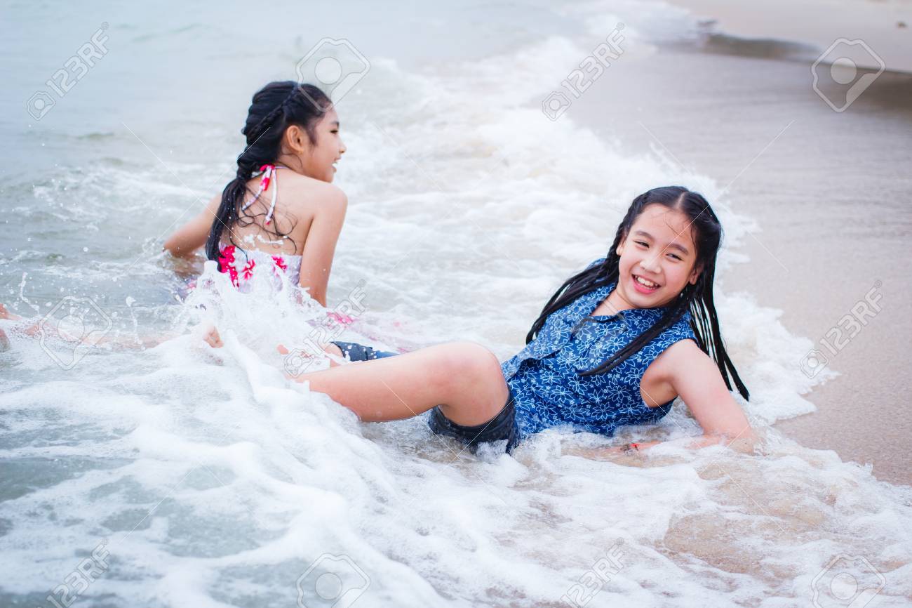 little thai girl swim Two Little Girls Are On The Beach, Thai Girl. Фотография, картинки,  изображения и сток-фотография без роялти. Image 95244693