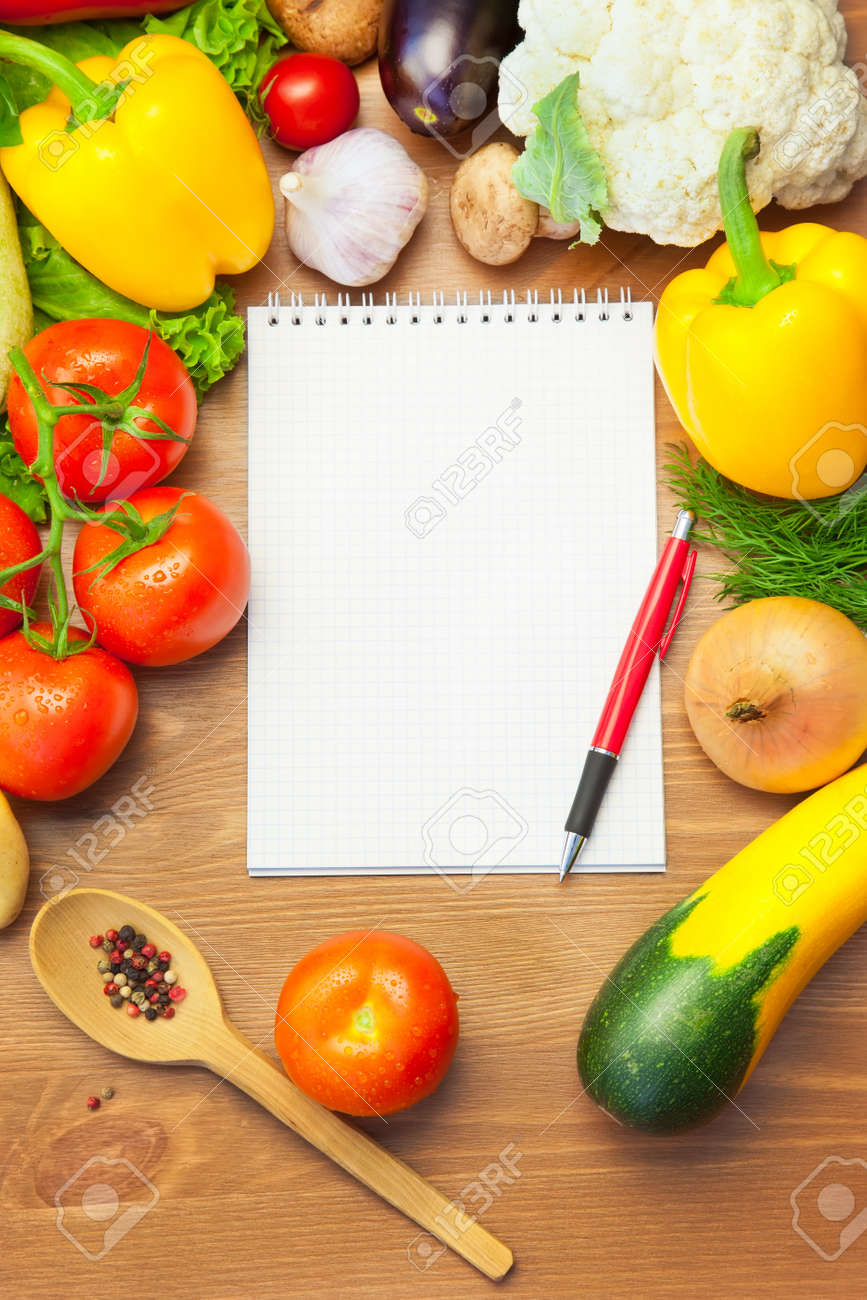 Organic Vegetables On Wooden Background And Notebook For Menu