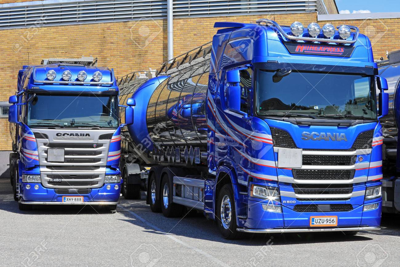 Stock Photo - TURKU, FINLAND - JULY 29, 2017: Scania R series tank trucks  of Niinexpress Oy parked on a yard, right Next Generation Scania R500, ...