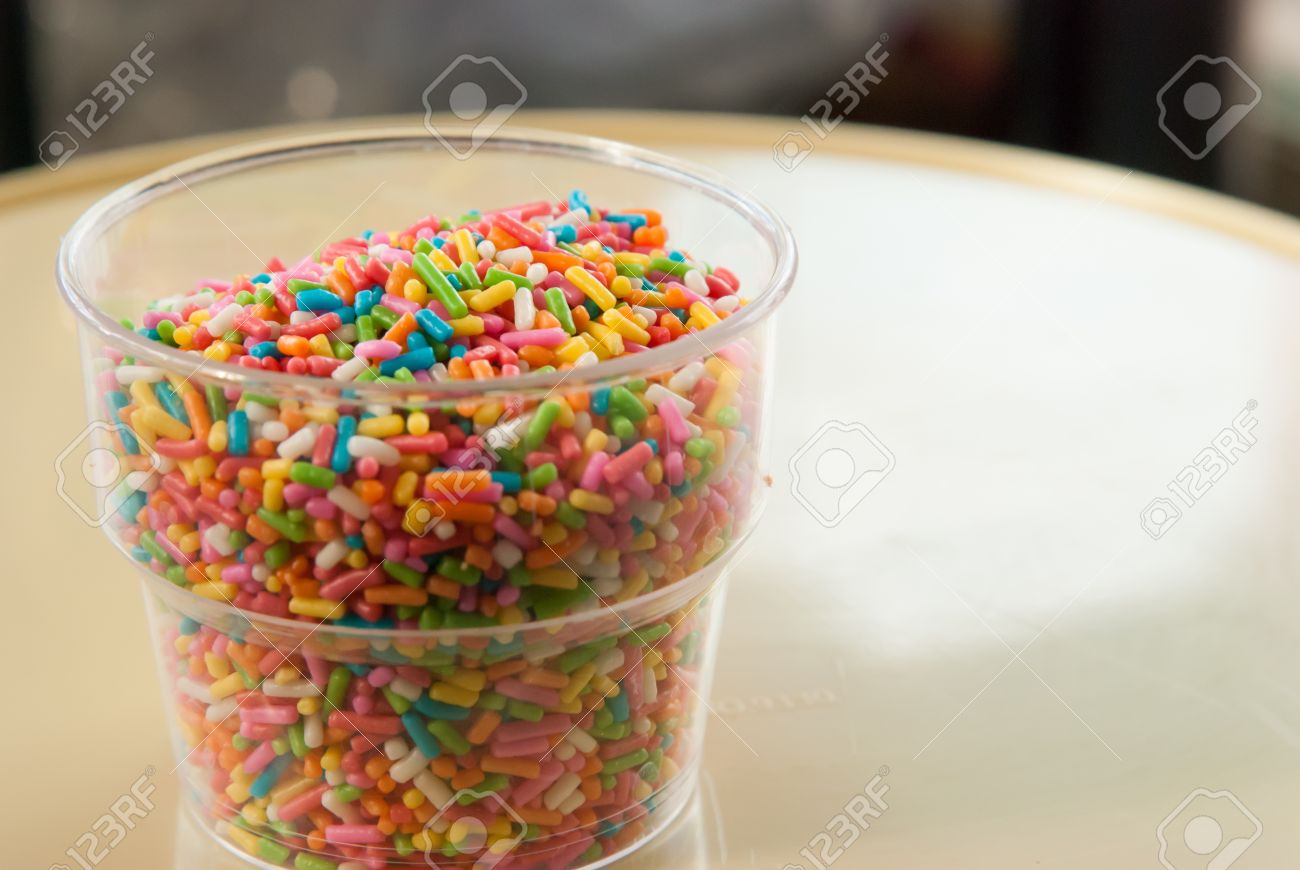 candy sugar sprinkles in plastic cup stock photo picture and