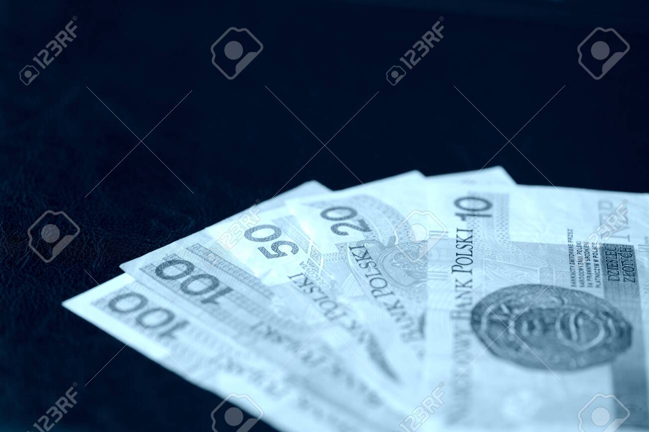 Several Banknotes Of Polish Zloty Blue Color Toned Close Up Stock
