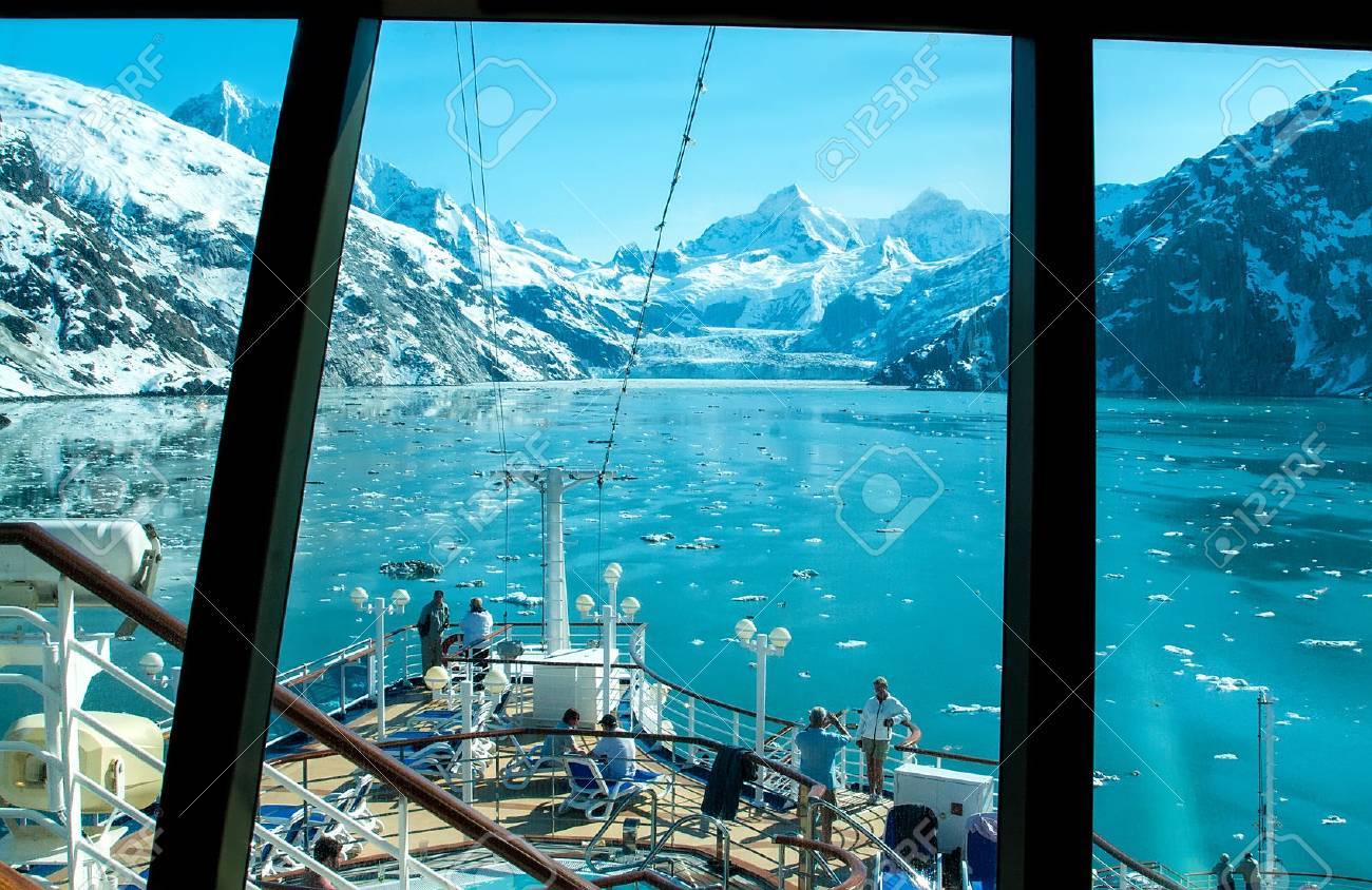 Glacier Bay, Alaska - June 1, 2009: View through a cruise ship window of a glacier in Glacier Bay. Passengers take in the scenic view before cruise ship departs. - 56159889 Glacier Bay, Alaska - June 1, 2009: View through a cruise ship window of a glacier in Glacier Bay. Passengers take in the scenic view before cruise ship departs. - 56159889