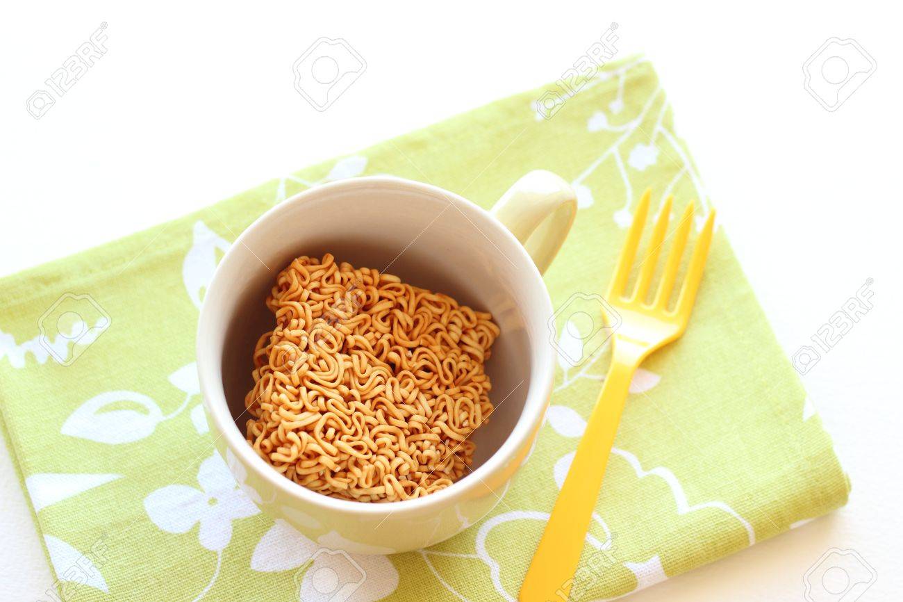 Japanese Instant Noodle In Mug Cup With Yellow Fork Stock Photo Picture And Royalty Free Image Image