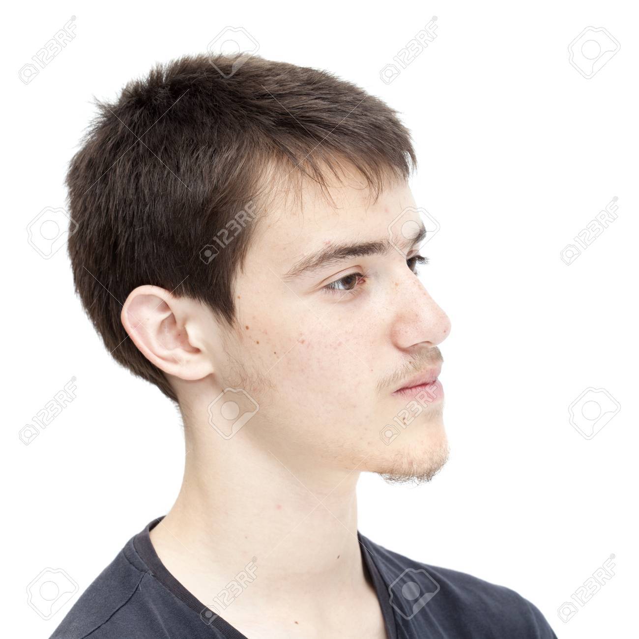 Teenage Boy With Short Dark Hair Isolated On White Stock Photo