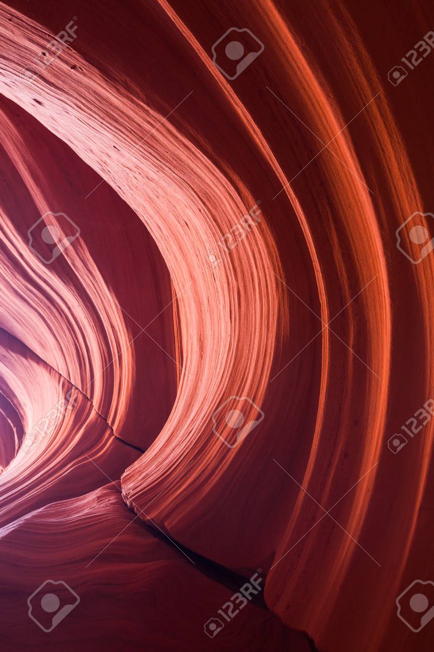 light and shadows play over smoothly eroded sandstone walls with playover