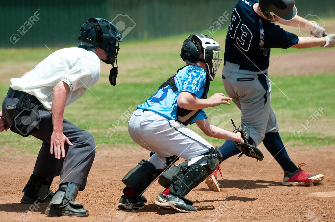 Baseball catcher with referee and batter during the game behind the plate. - 51765311 Baseball catcher with referee and batter during the game behind the plate. - 51765311