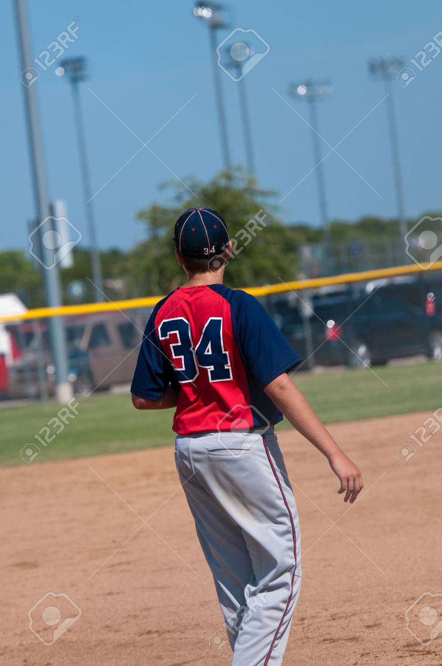 boy in baseball uniform