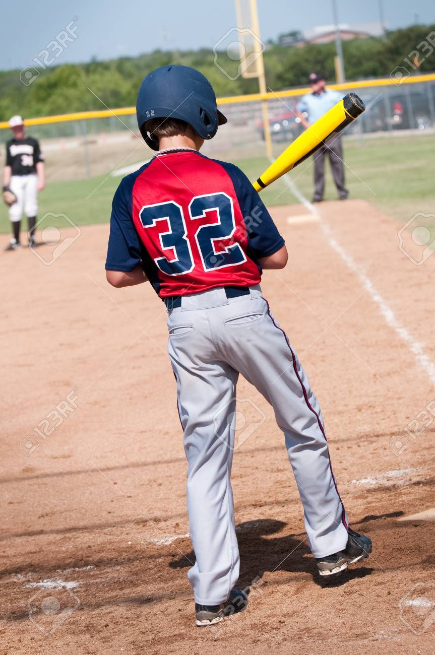 boy in baseball uniform