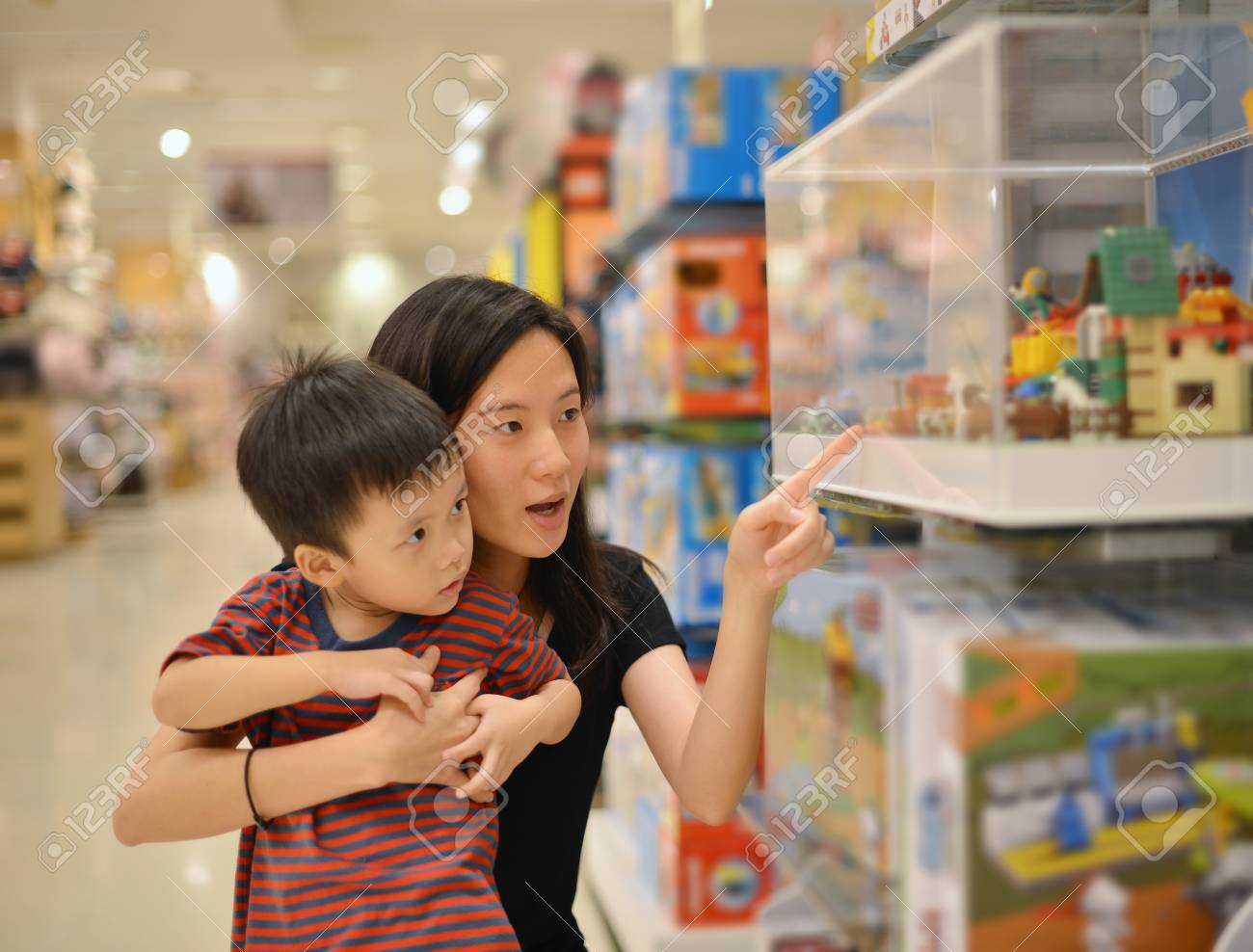 Young Asian Mother And Her Kid Shopping Toy In Shopping Mall Stock Photo Picture And Royalty Free Image Image 94061955
