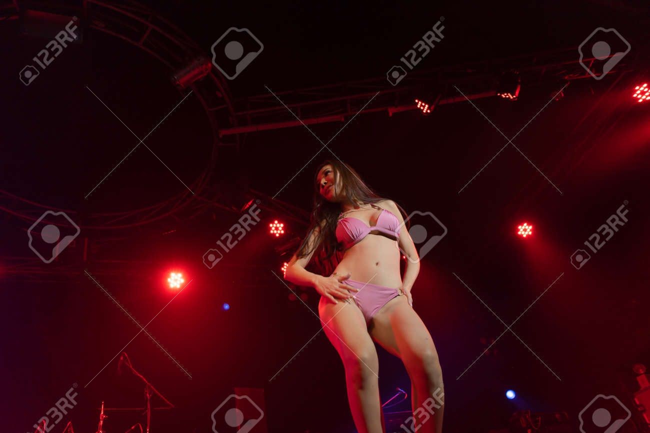 Sexy Asian Thai Woman With Underwear, A Dancer, Dancing On Stage In Disco  Pub Club Bar Background In Party Music Dancing Festival Performance Show.  Entertainment Nightlife. People Lifestyle. Stock Photo, Picture and