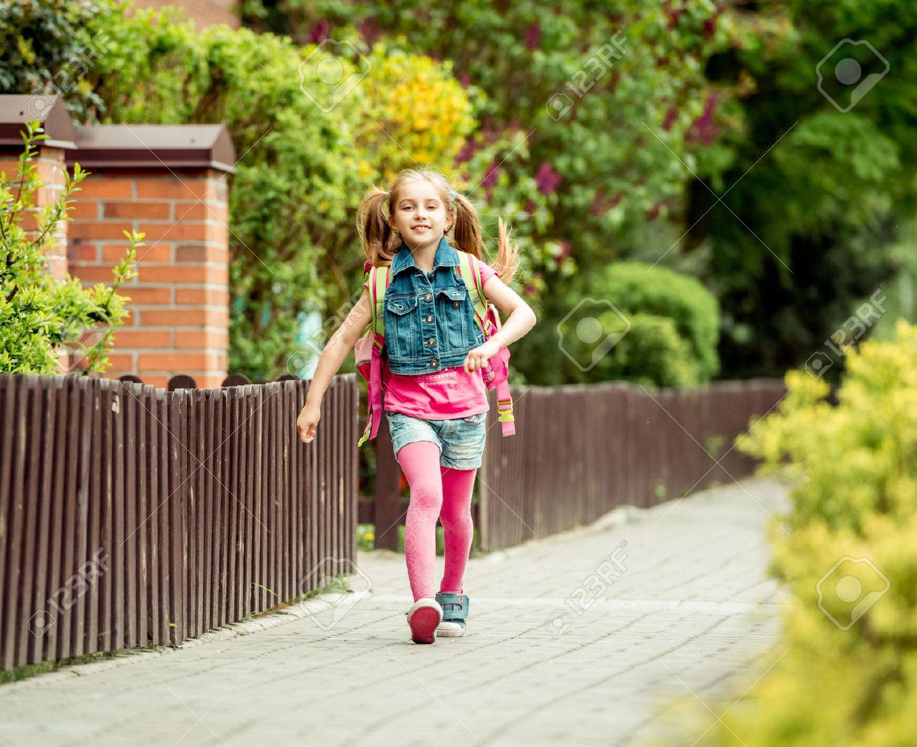little girl with a backpack going to school. - 43021550 little girl with a backpack going to school. - 43021550