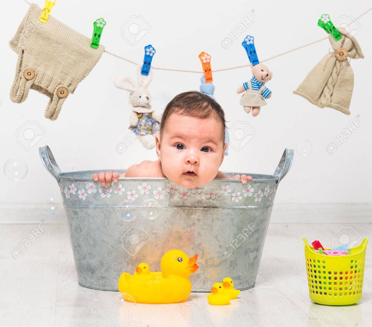 little two-month girl bathes in a trough and dry her clothes - 43286437 little two-month girl bathes in a trough and dry her clothes - 43286437