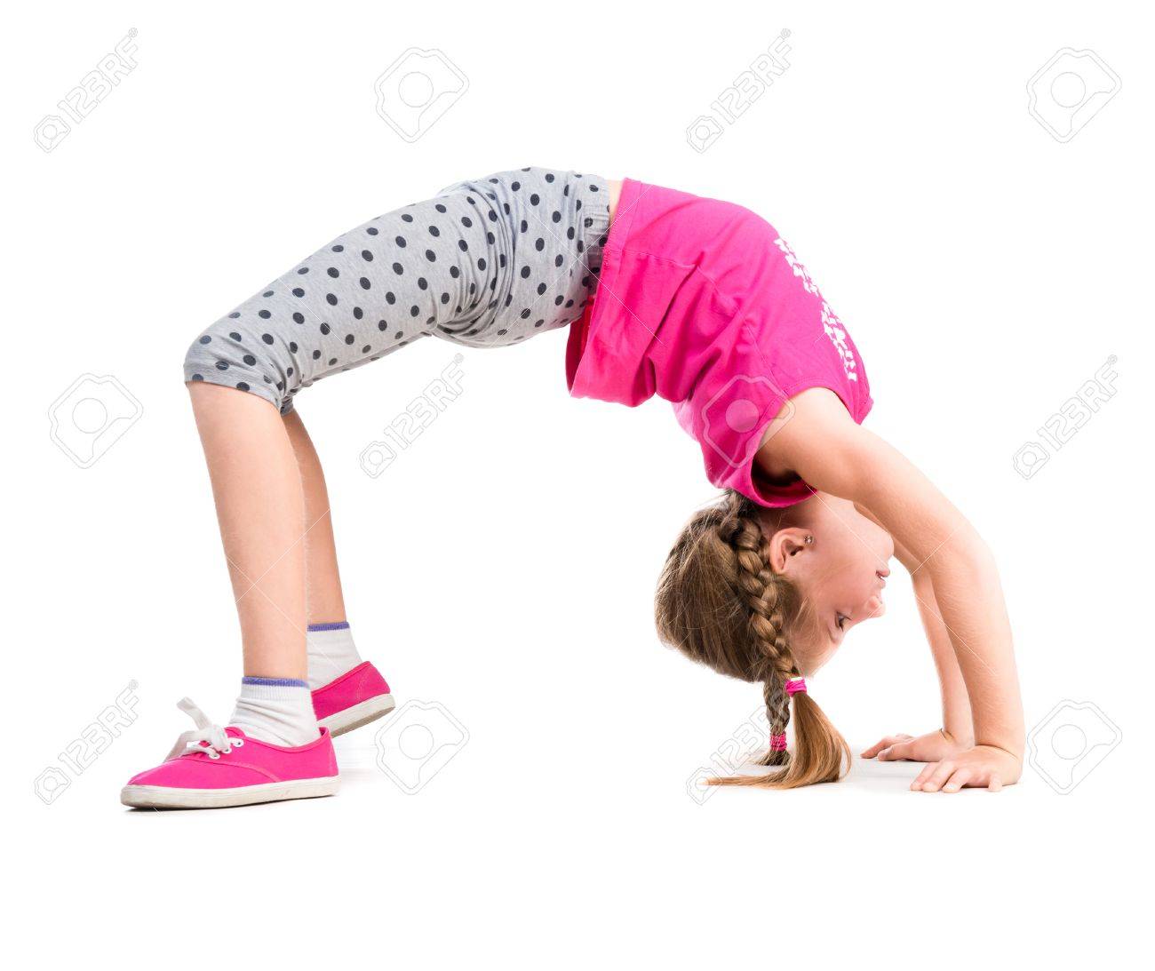 little girl doing the bridge exercise isolated on white background - 44481561 little girl doing the bridge exercise isolated on white background - 44481561