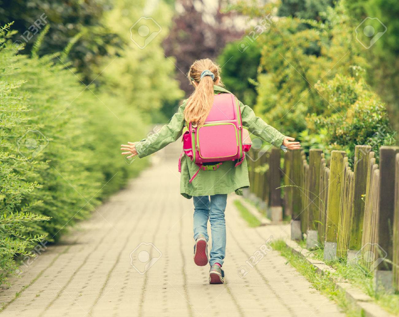 little girl with a backpack going to school. back view - 44481580 little girl with a backpack going to school. back view - 44481580