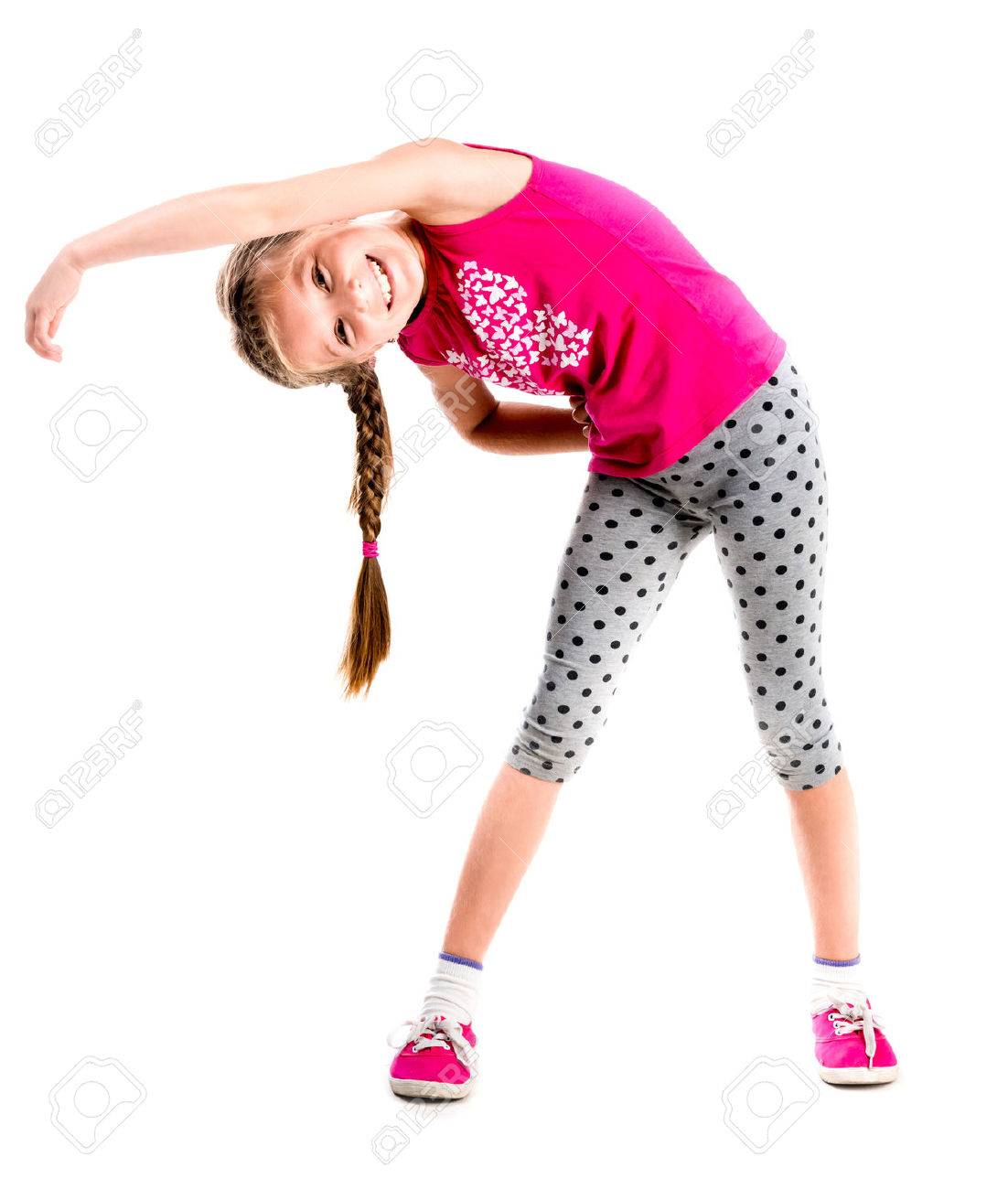 little girl standing with hands on sides doing fitness - 44481587 little girl standing with hands on sides doing fitness - 44481587