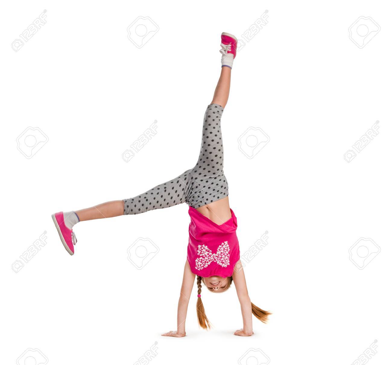 little girl turning handsprings in a studio - 44481610 little girl turning handsprings in a studio - 44481610