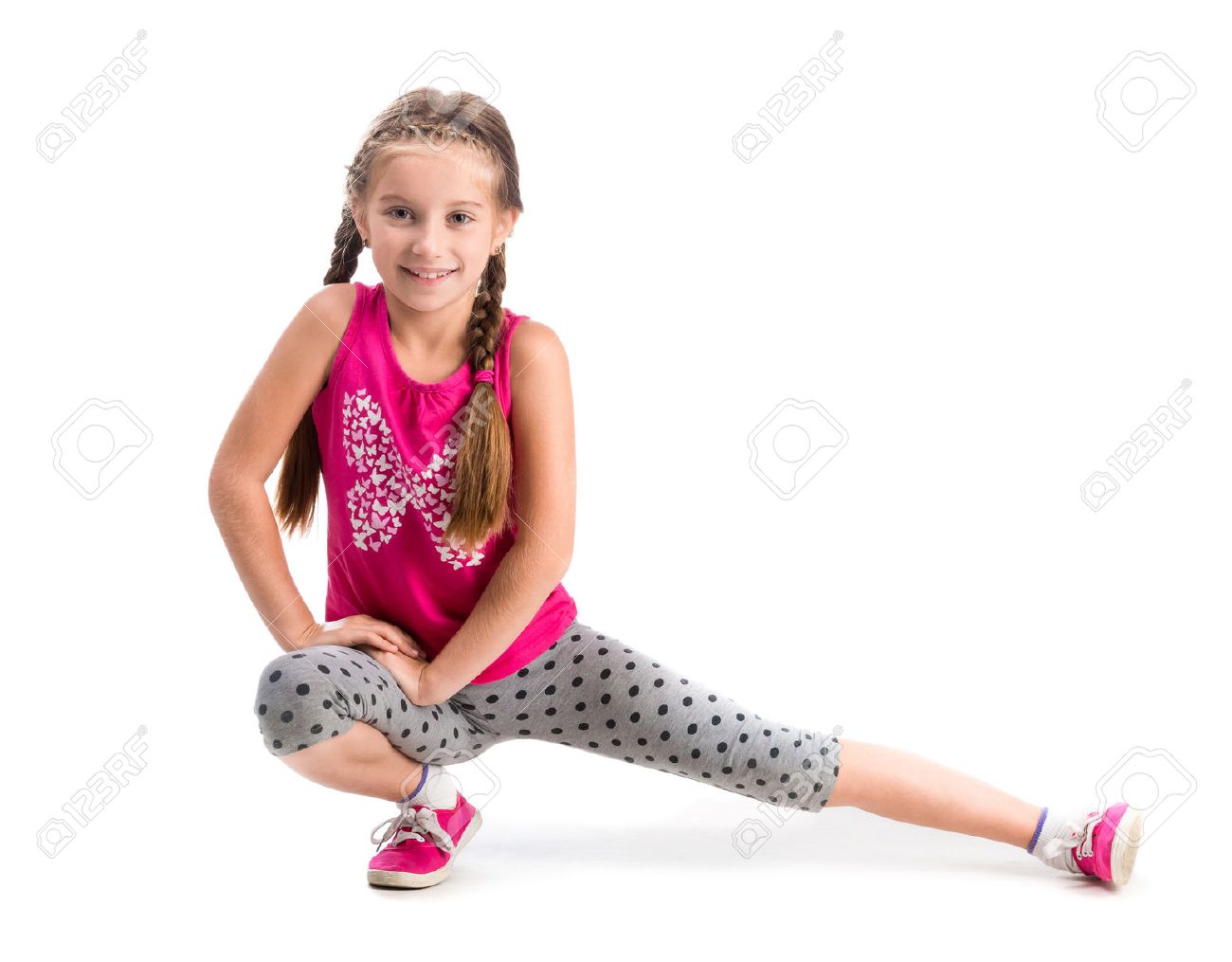 smiling little girl doing exercise isolated on white background - 44481647 smiling little girl doing exercise isolated on white background - 44481647