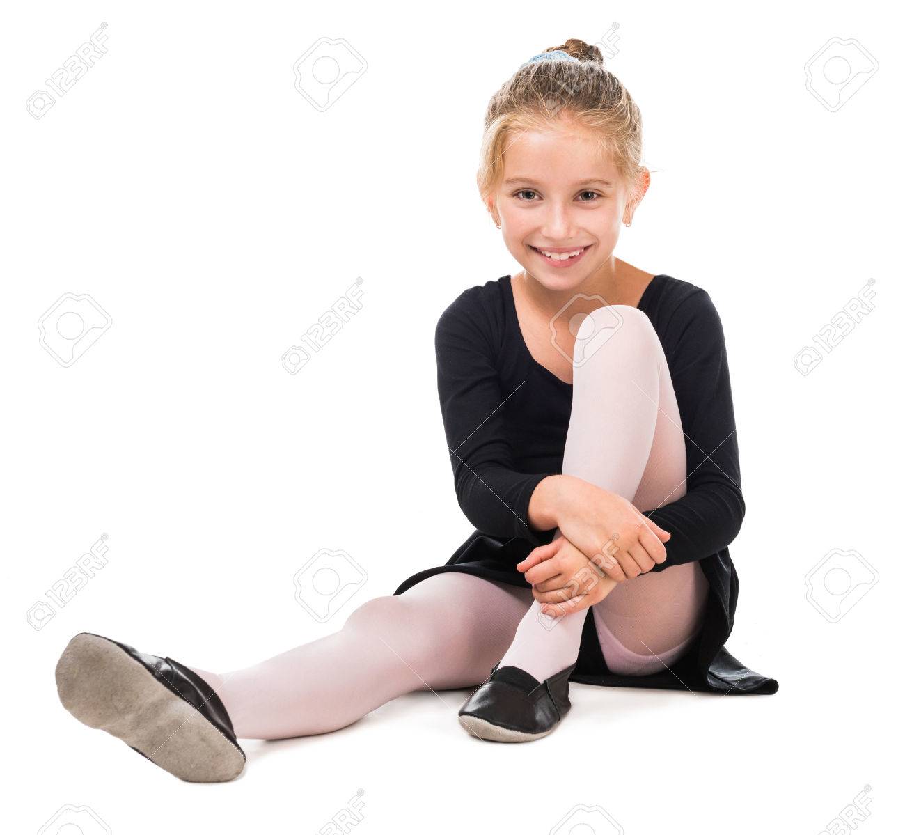 smiling little gymnast on the floor isolated on white background - 44711613 smiling little gymnast on the floor isolated on white background - 44711613