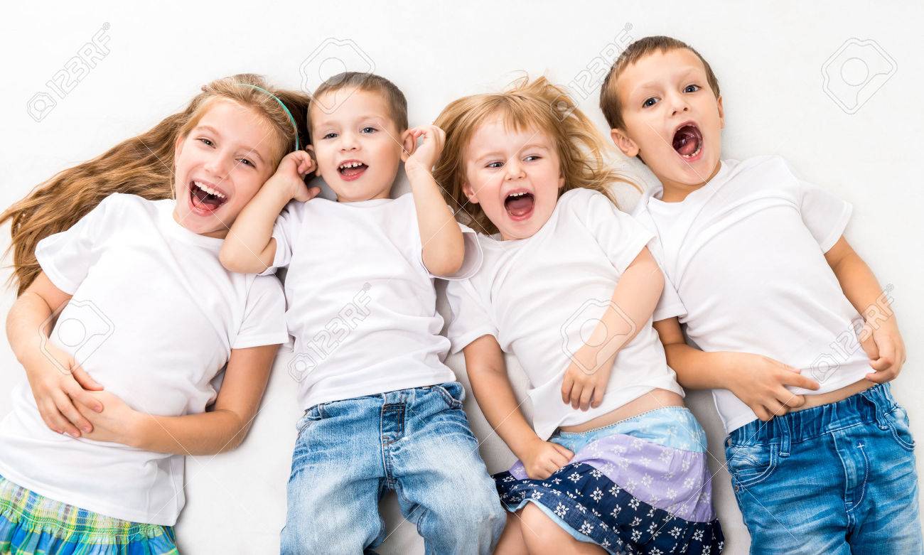 children in white shirts lying on the floor isolated on white background - 45297054 children in white shirts lying on the floor isolated on white background - 45297054