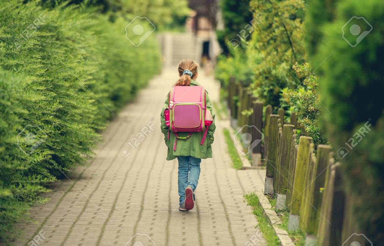 little girl with a backpack going to school. back view - 47391319 little girl with a backpack going to school. back view - 47391319