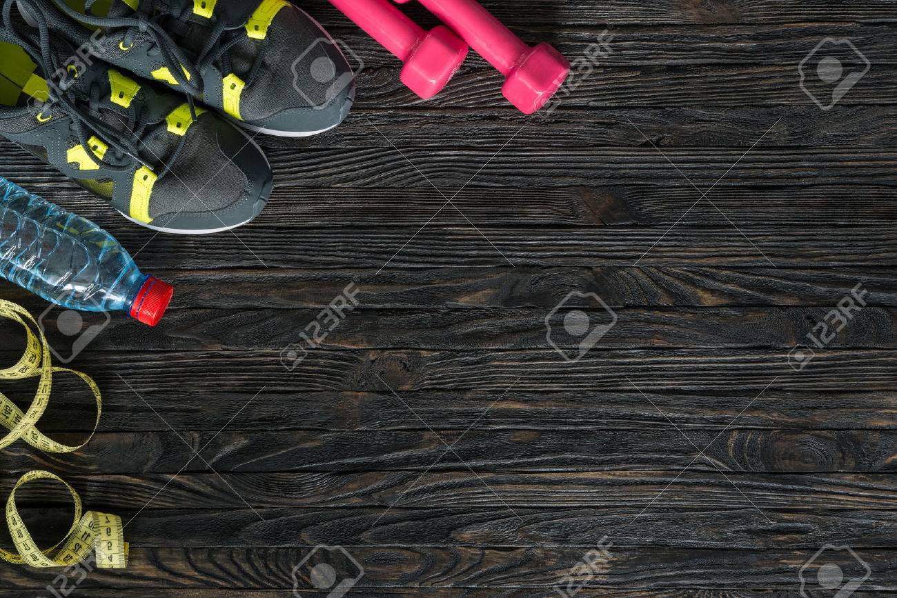 sport fitness items on dark wooden background with empty text space - 50806268 sport fitness items on dark wooden background with empty text space - 50806268
