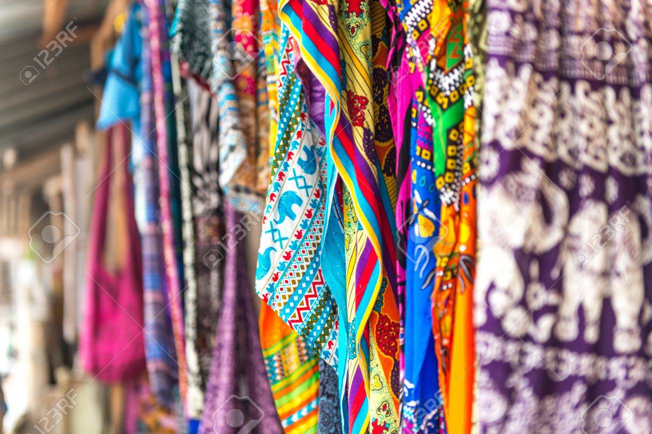colorful patterned shawls and fabric at Zanzibar traditional street market, Africa - 64186044 colorful patterned shawls and fabric at Zanzibar traditional street market, Africa - 64186044
