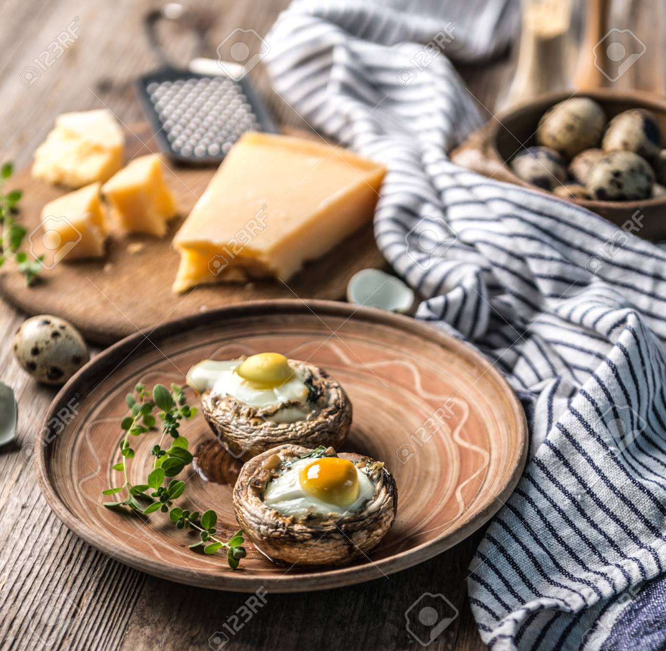 Stuffed mushrooms with quail eggs and parmesan cheese. - 91246149 Stuffed mushrooms with quail eggs and parmesan cheese. - 91246149