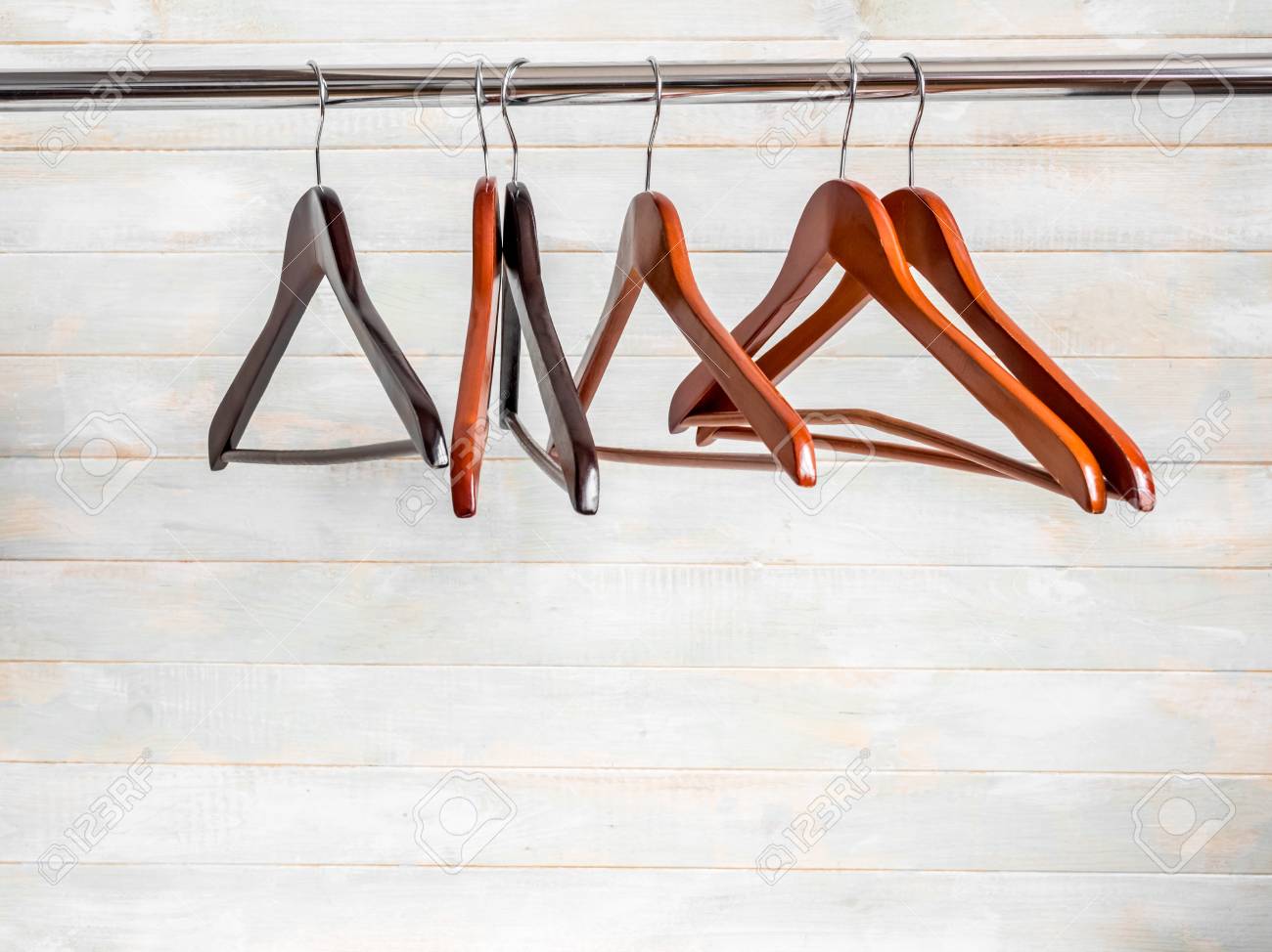 Brown wooden hangers on the rack - 105808910 Brown wooden hangers on the rack - 105808910