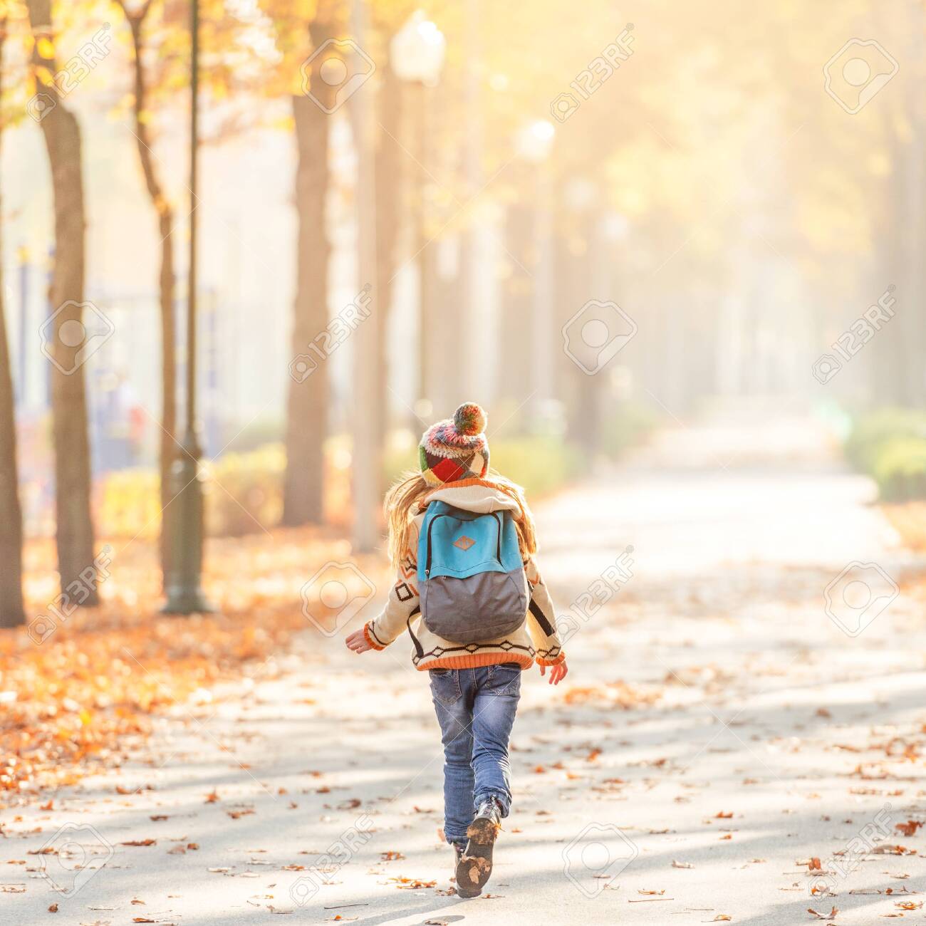 kid running with backpack