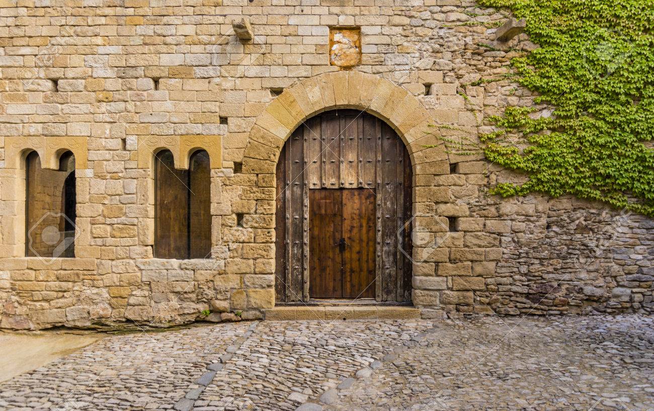 Ancient Wooden Door And Stone Gate Of A Castle In Peratallada ... Ancient Wooden Door And Stone Gate Of A Castle In Peratallada ...