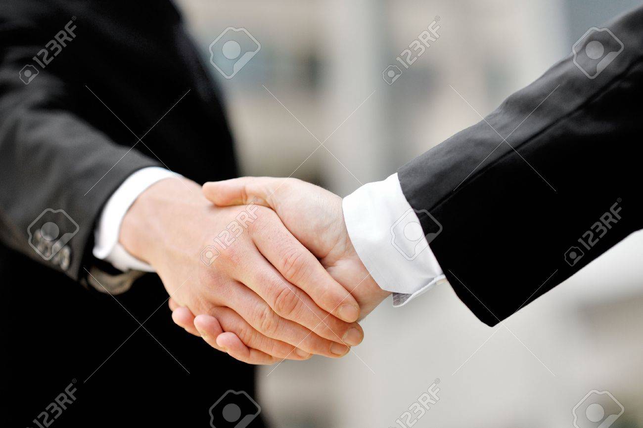 two businessmen shaking hands - business deal partnership concept - 30534183 two businessmen shaking hands - business deal partnership concept - 30534183