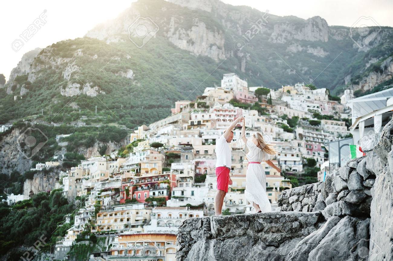 young beautiful happy couple dancing in Positano, Amalfi coast, Italy - 50769913 young beautiful happy couple dancing in Positano, Amalfi coast, Italy - 50769913