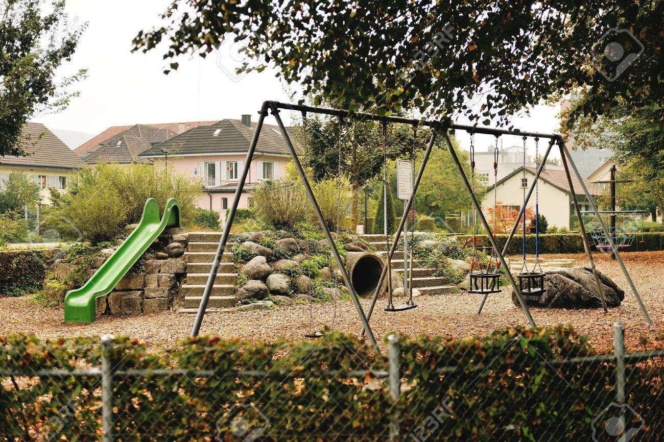 swing and slide in a park bremgarten switzerland stock photo