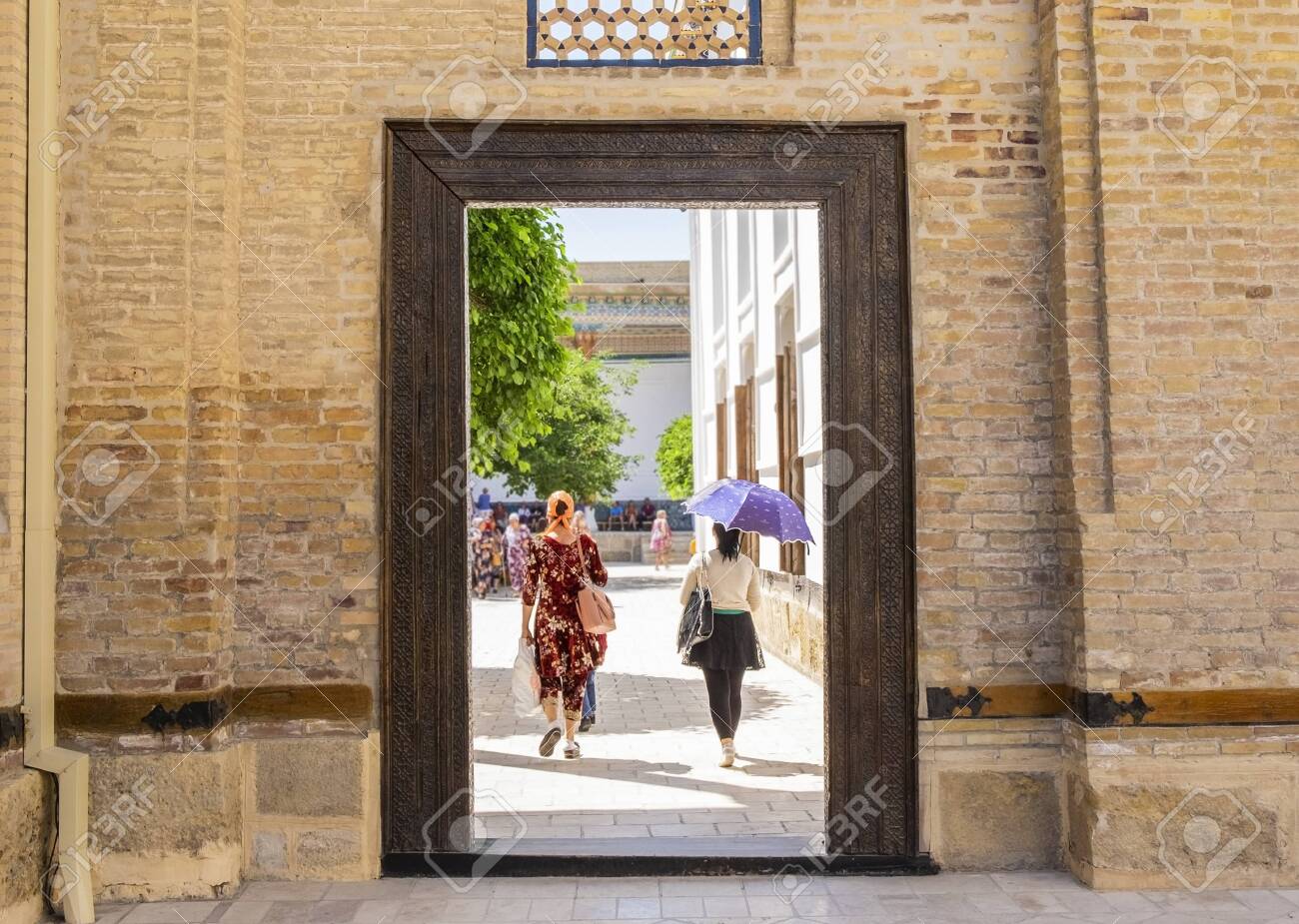 People Walking Through The Door In Memorial Complex Of Khoja