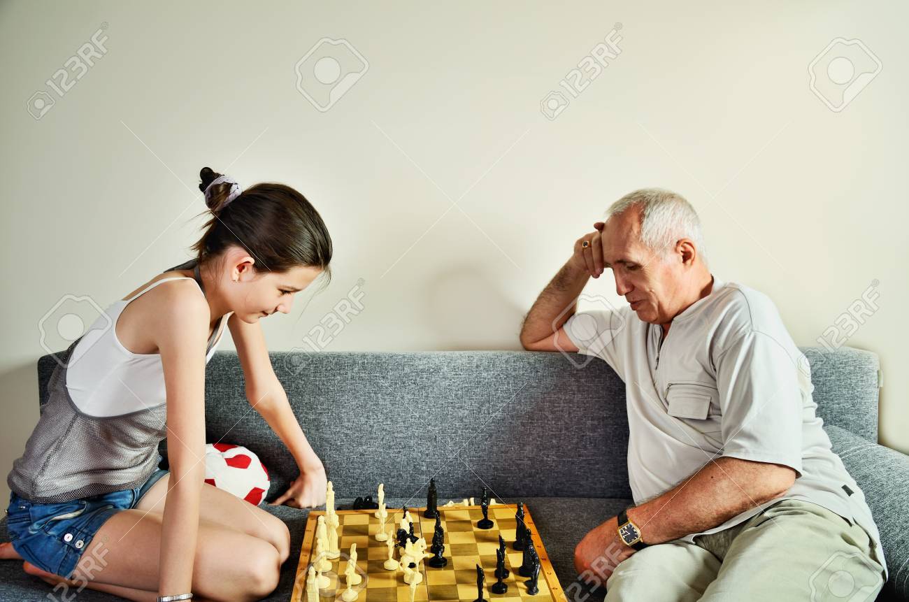 Teenager Playing Chess with his Grandfather · Free Stock Photo