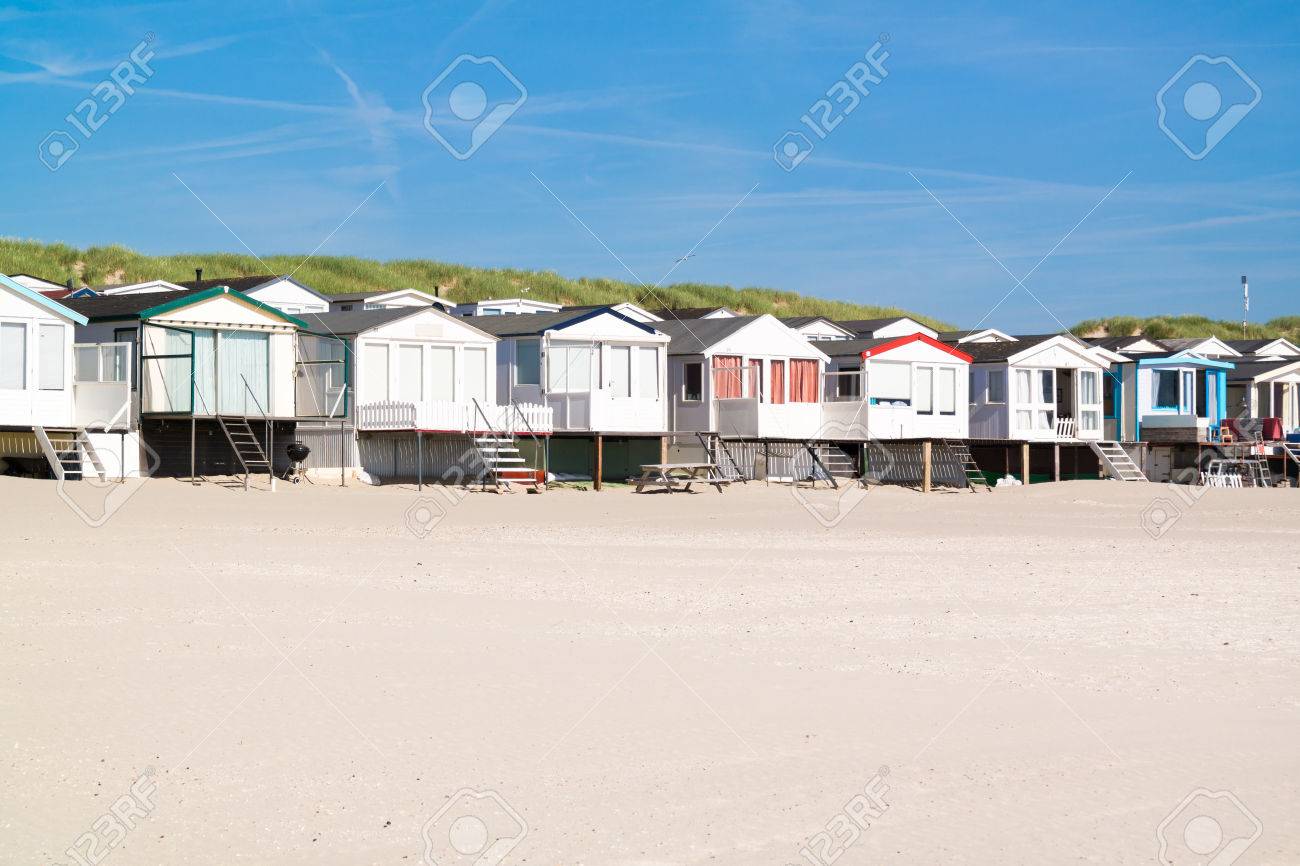 Row Of Beach Houses Or Huts On Ijmuiden Beach At North Sea Coast Stock Photo