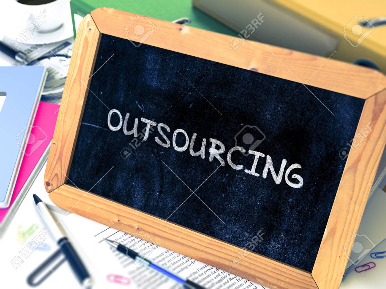 outsourcing handwritten by chalk on a blackboard composition