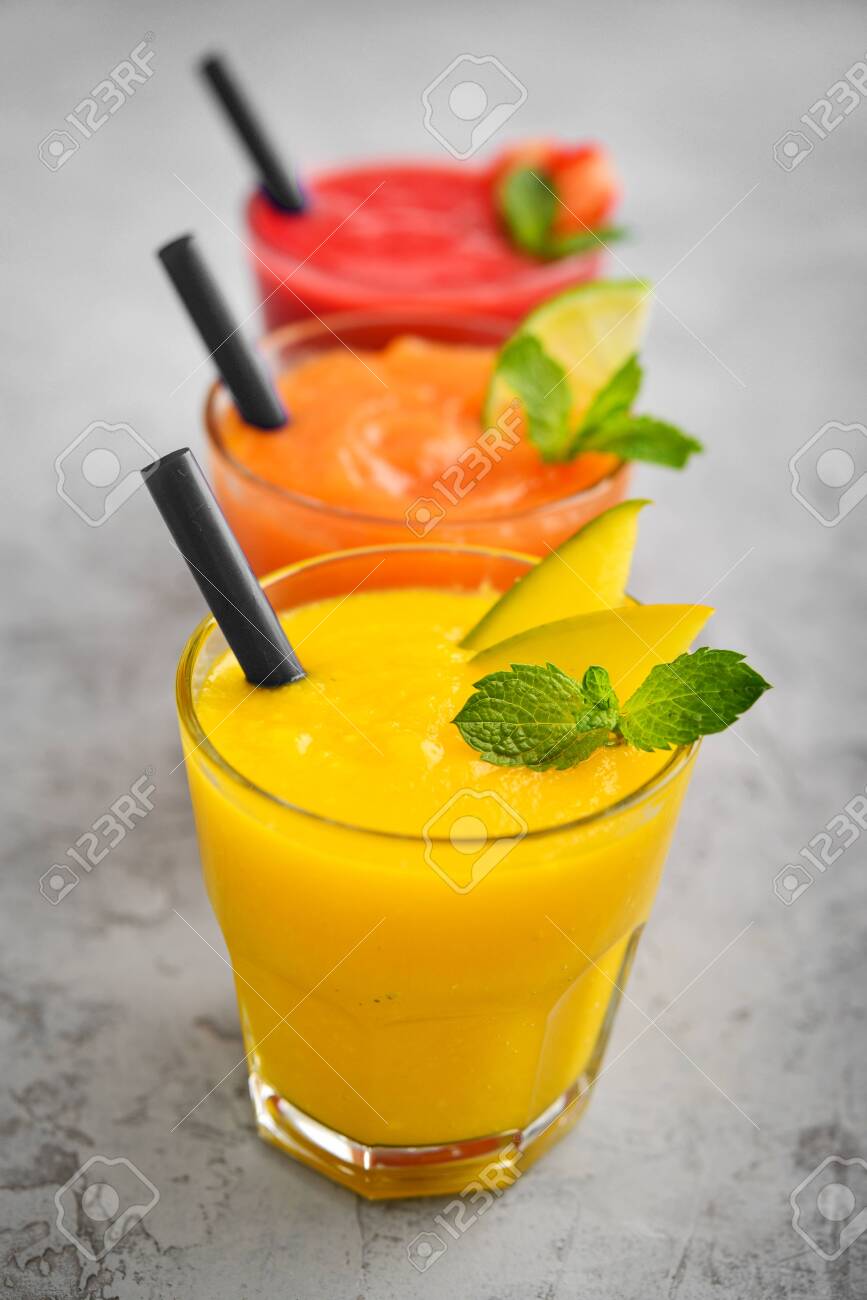 Fresh Strawberry Mango And Papaya Smoothies In Glasses On Grey Stock Photo Picture And Royalty Free Image Image 128131514
