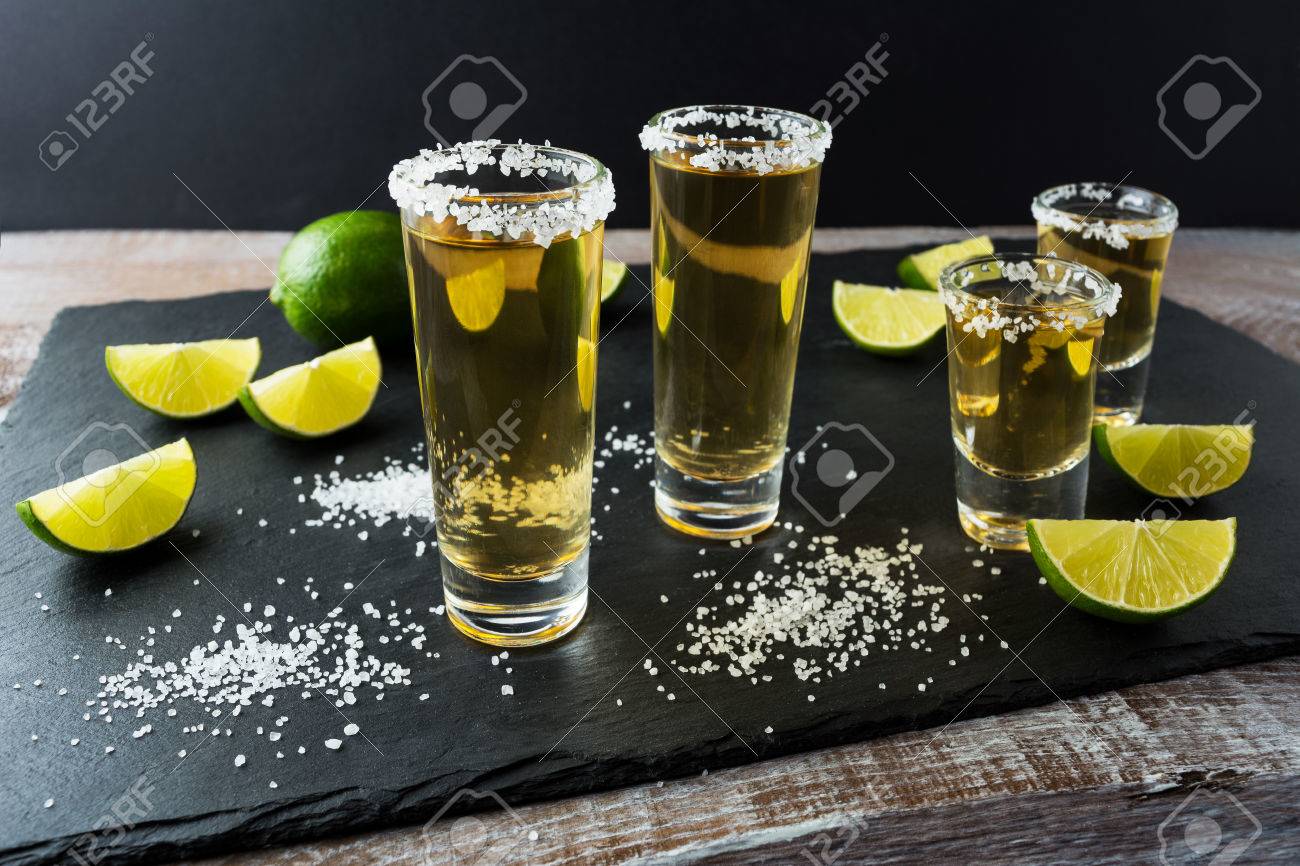 Tequila Shots With Lime On Black Stone Background Strong Alcohol Drink Gold Mexican Tequila Shots Stock Photo Picture And Royalty Free Image Image