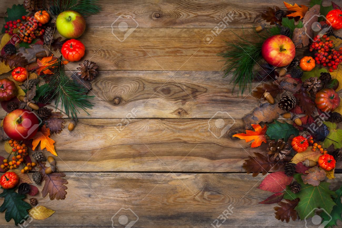rustic thanksgiving decoration with pumpkin apples and cones