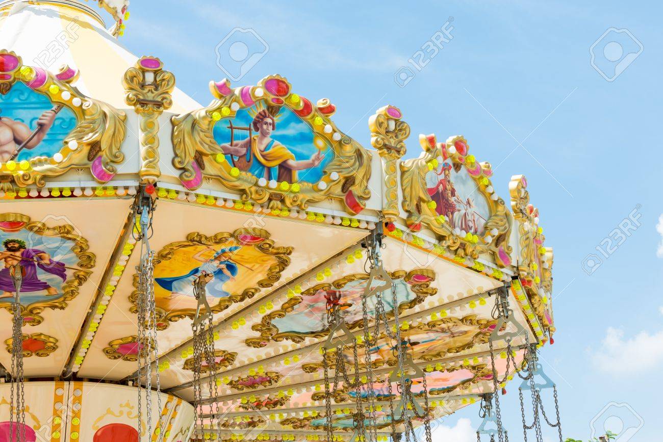 top section of marry go round amusement park ride with clear blue sky - 19612077 top section of marry go round amusement park ride with clear blue sky - 19612077