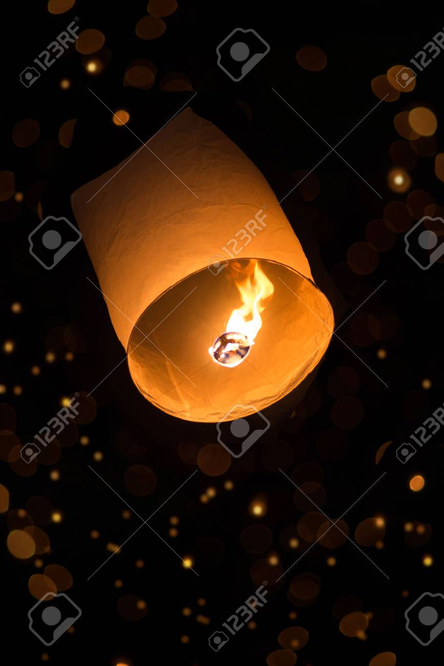 sky lantern with bokeh in the dark - 24063789 sky lantern with bokeh in the dark - 24063789