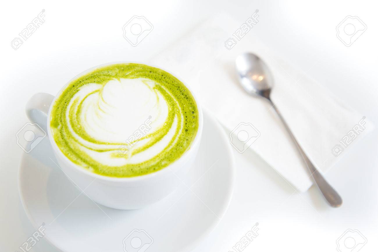 green tea latte art in white cup,isolated - 26746188 green tea latte art in white cup,isolated - 26746188